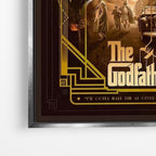 Close-up λεπτομέρεια καμβά The Godfather με ασημί κορνίζα.