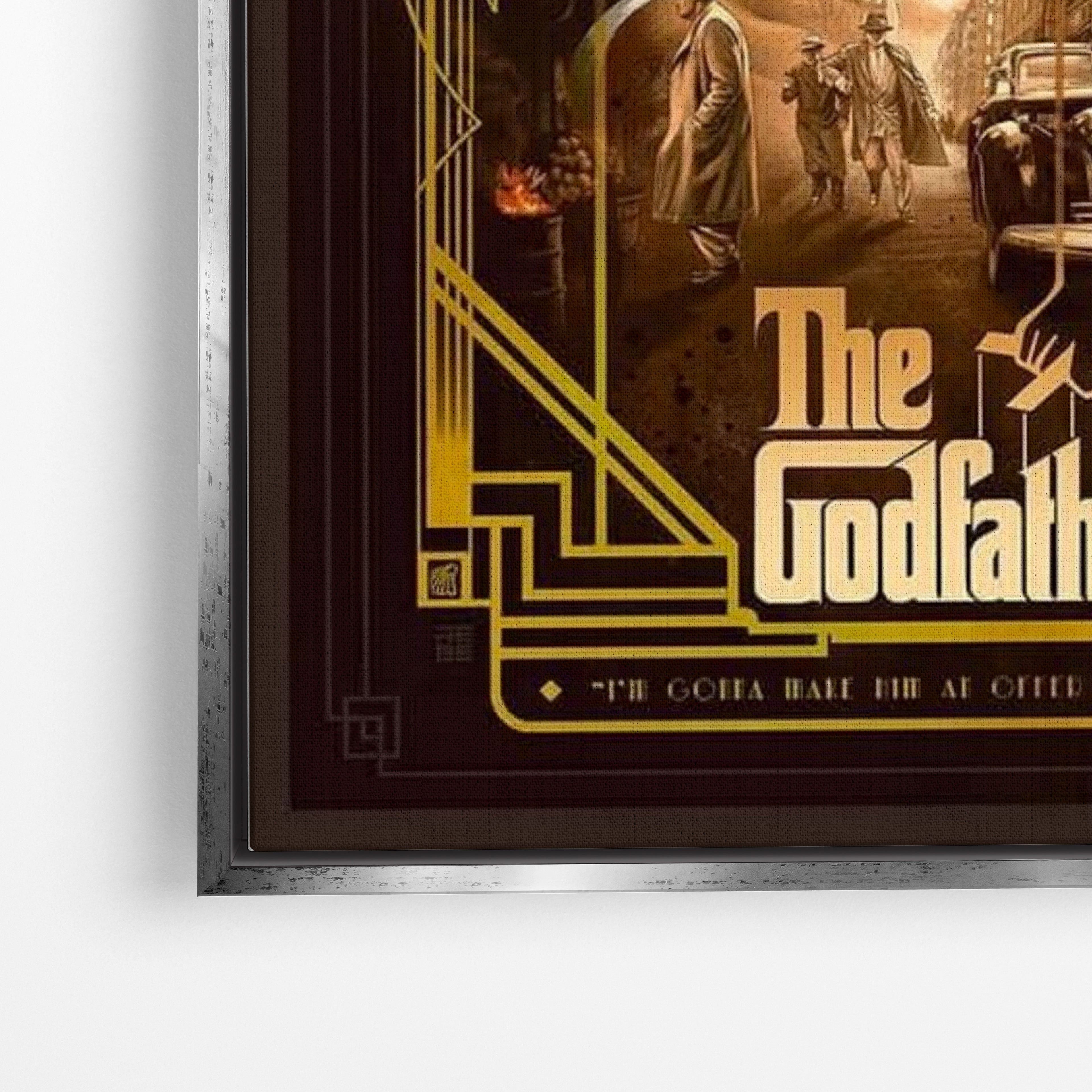 Close-up λεπτομέρεια καμβά The Godfather με ασημί κορνίζα.
