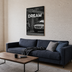 Ασπρόμαυρος πίνακας «It All Starts With a Dream» σε μοντέρνο σαλόνι με μπλε καναπέ.

