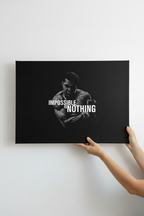 Hands holding Ali canvas on white wall