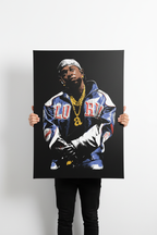 Hands holding Kendrick Lamar canvas
