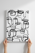 Hands holding Many Faces canvas