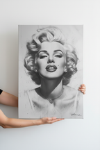 Hands holding Marilyn Monroe canvas