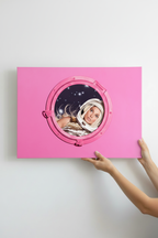 Hands holding Space Barbie canvas