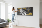 Lifestyle shot - Woman hanging frameless canvas