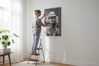 Realistic lifestyle shot - Woman hanging canvas