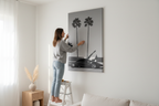 Realistic lifestyle shot - Woman hanging canvas